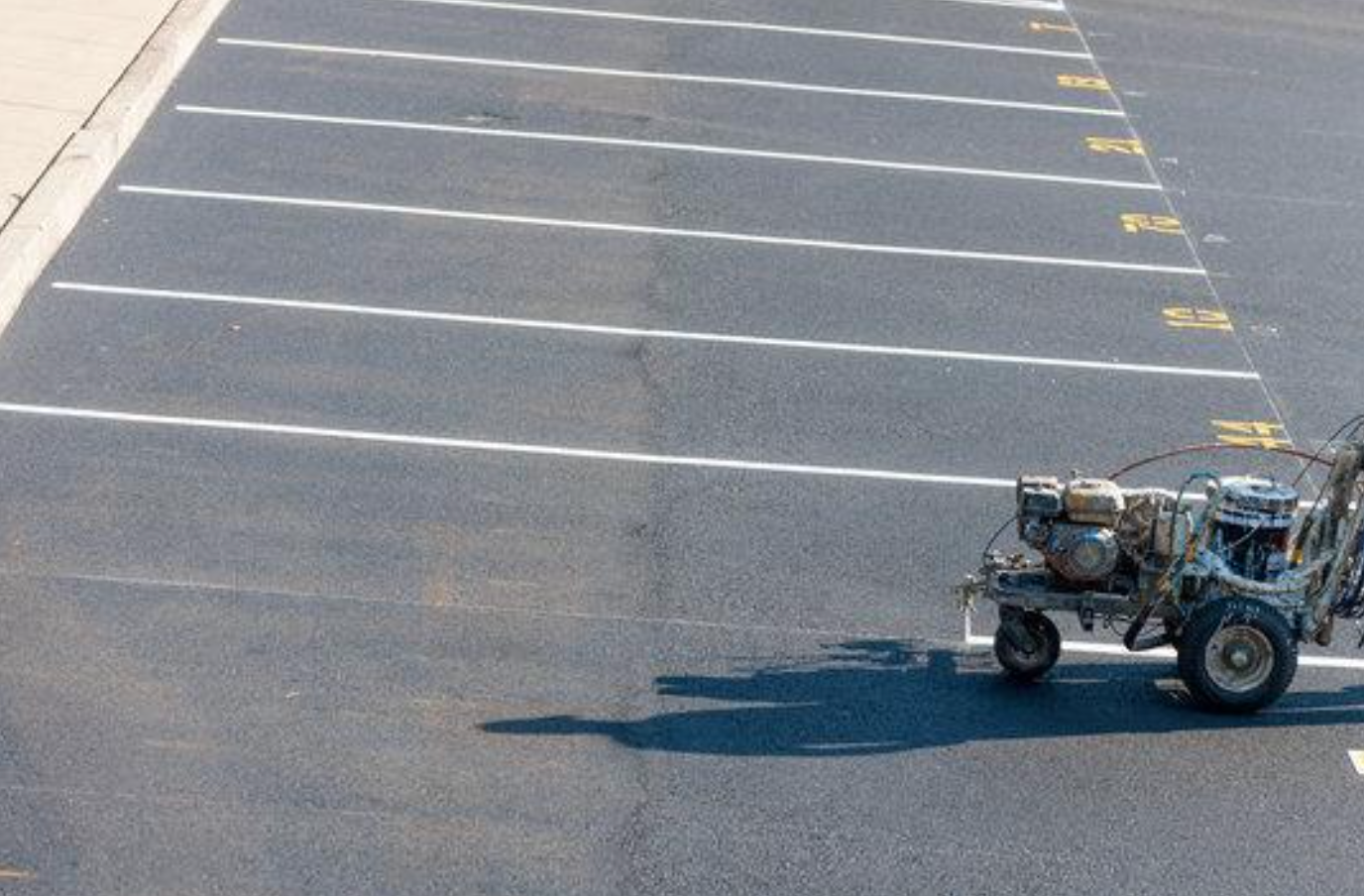 Parking lot striping with a high tech machine