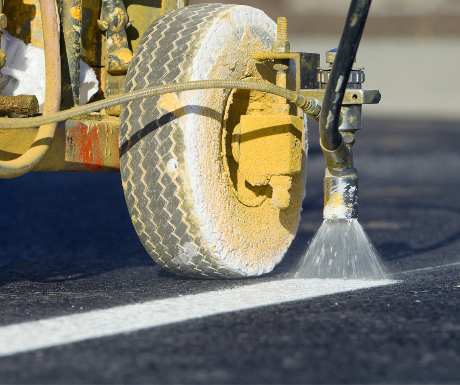 A machine striping a parking lot with durable paint